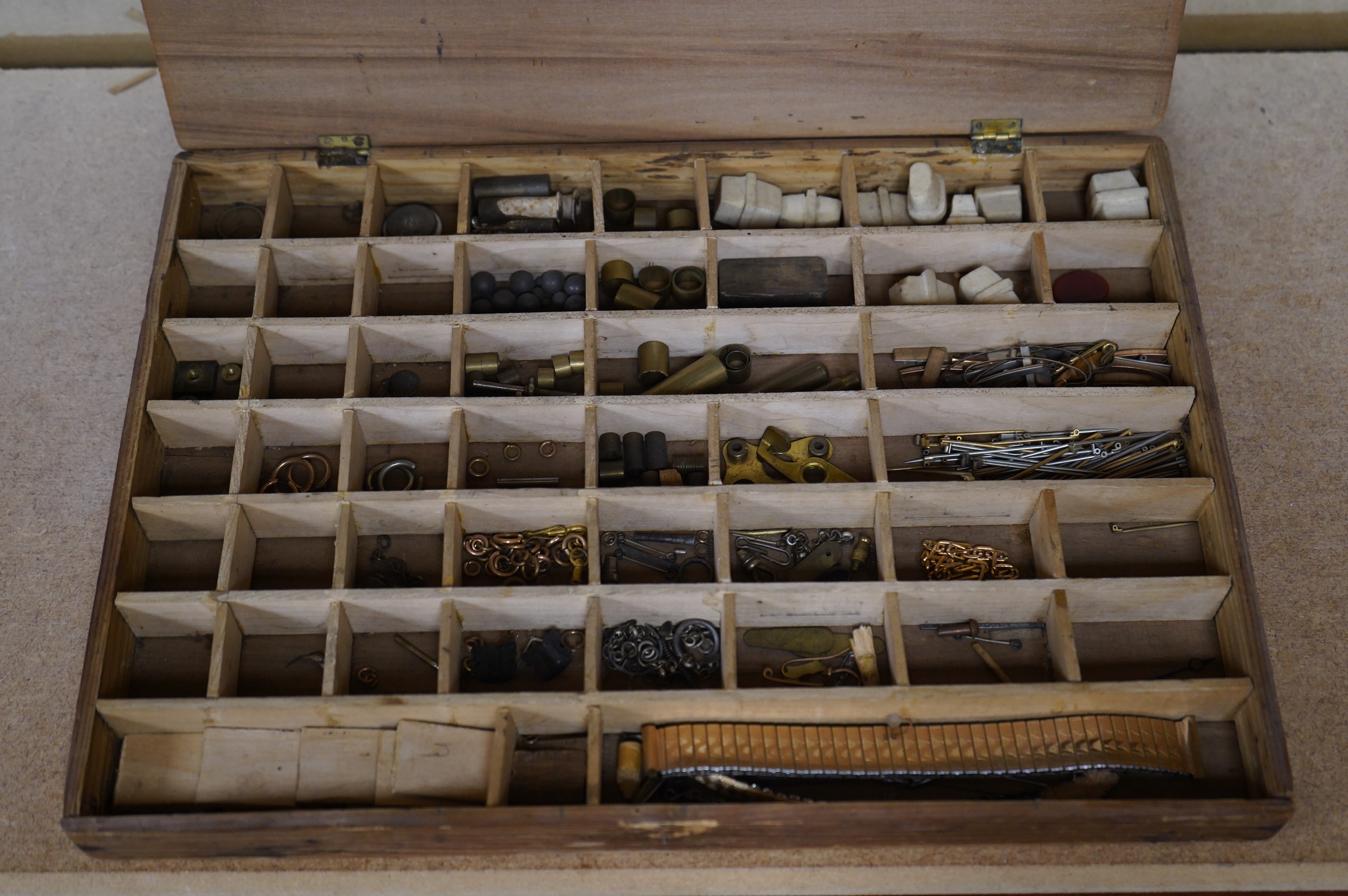 A quantity of clock parts, keys and tools of interest to a clock repairer. Condition - varies